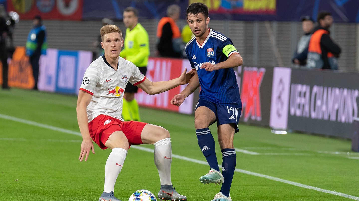 Champions League football players fighting for the ball