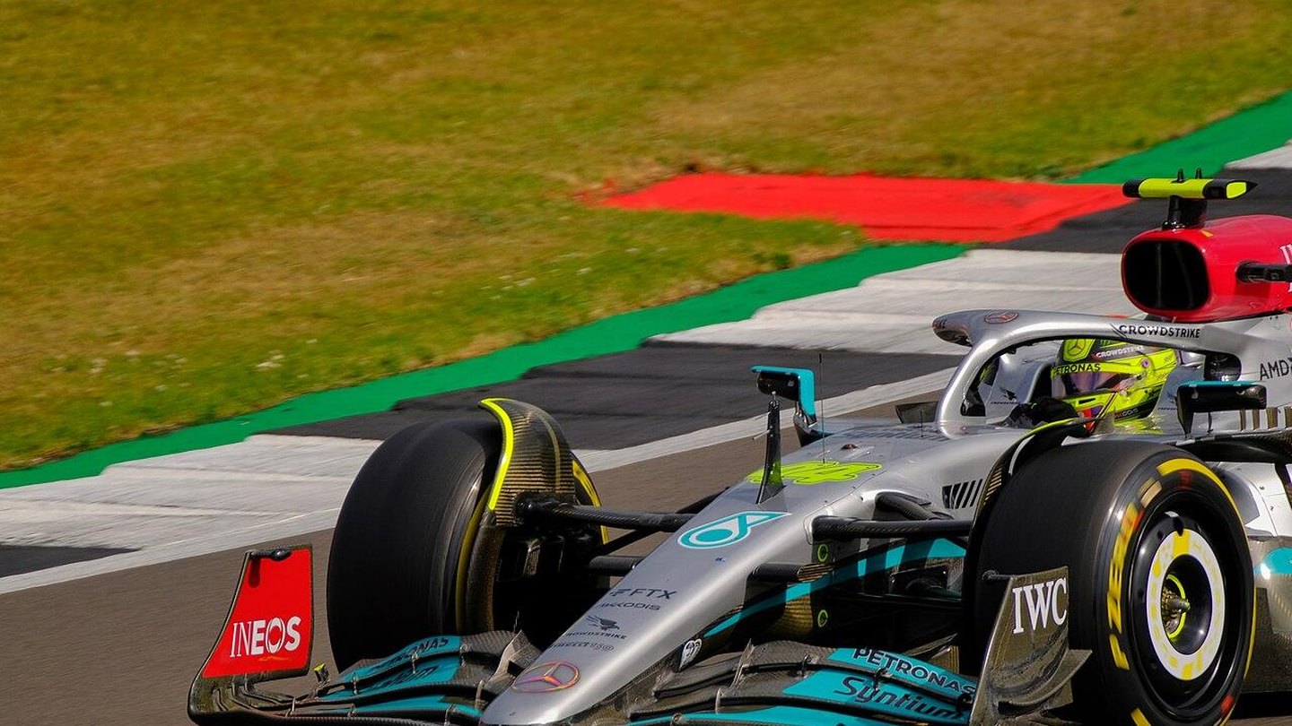 Formula 1 car cornering on a Grand Prix circuit